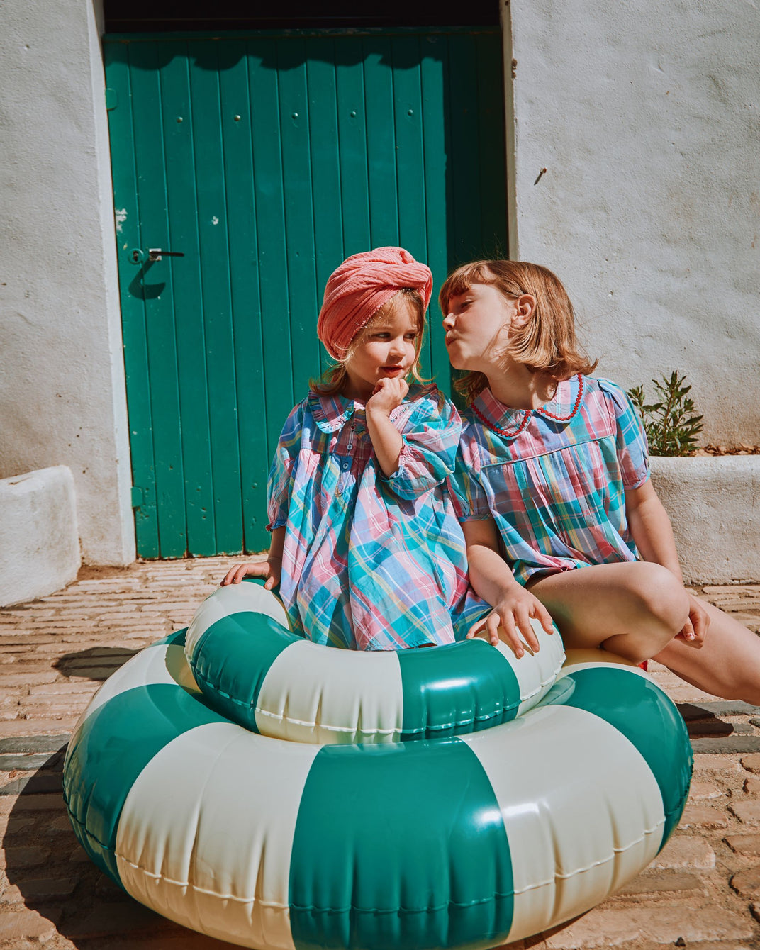 Multicolored madras plaid pleated blouse