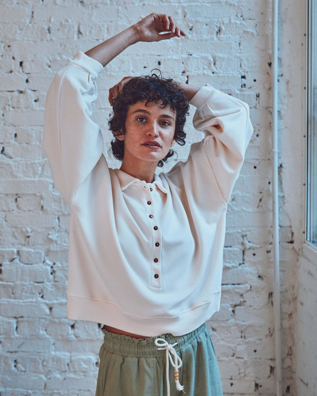 Cream organic cotton button-down sweatshirt