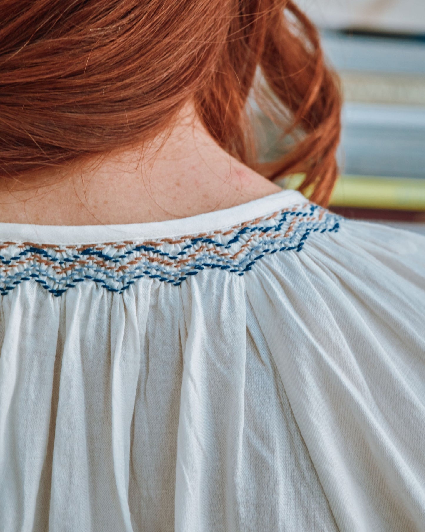 cream embroidered smocked blouse