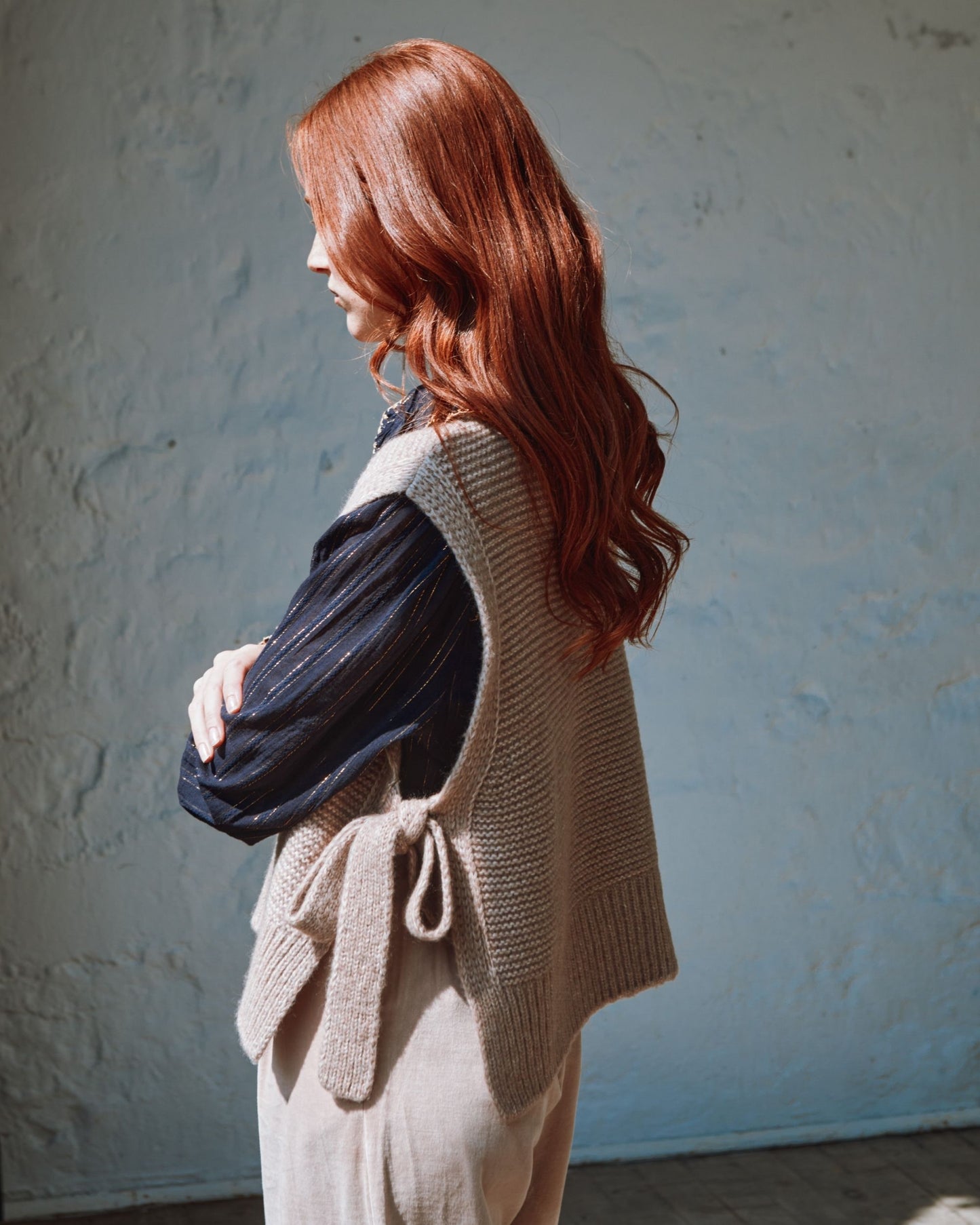 beige sleeveless tie-up sweater