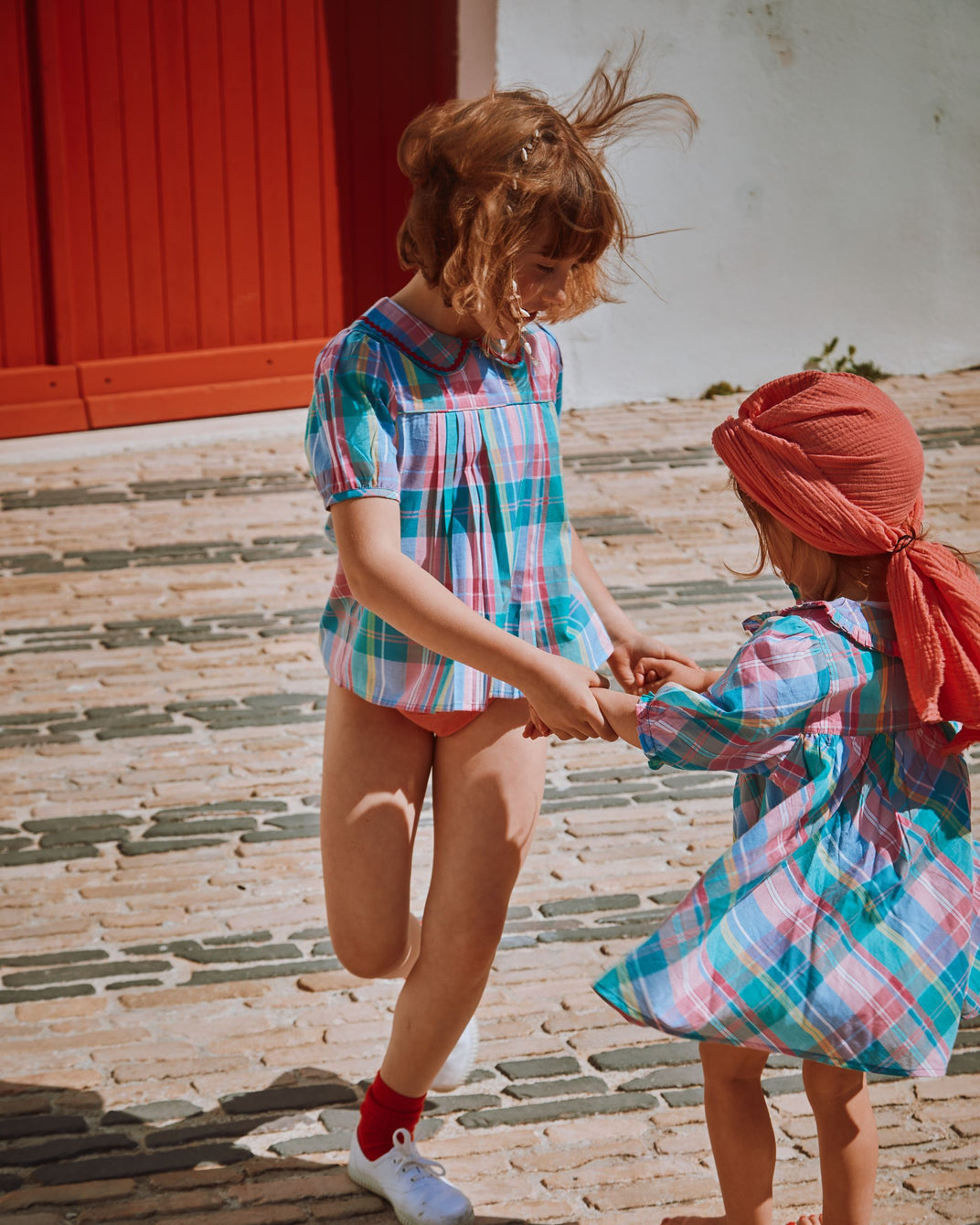 Multicolored madras plaid pleated blouse