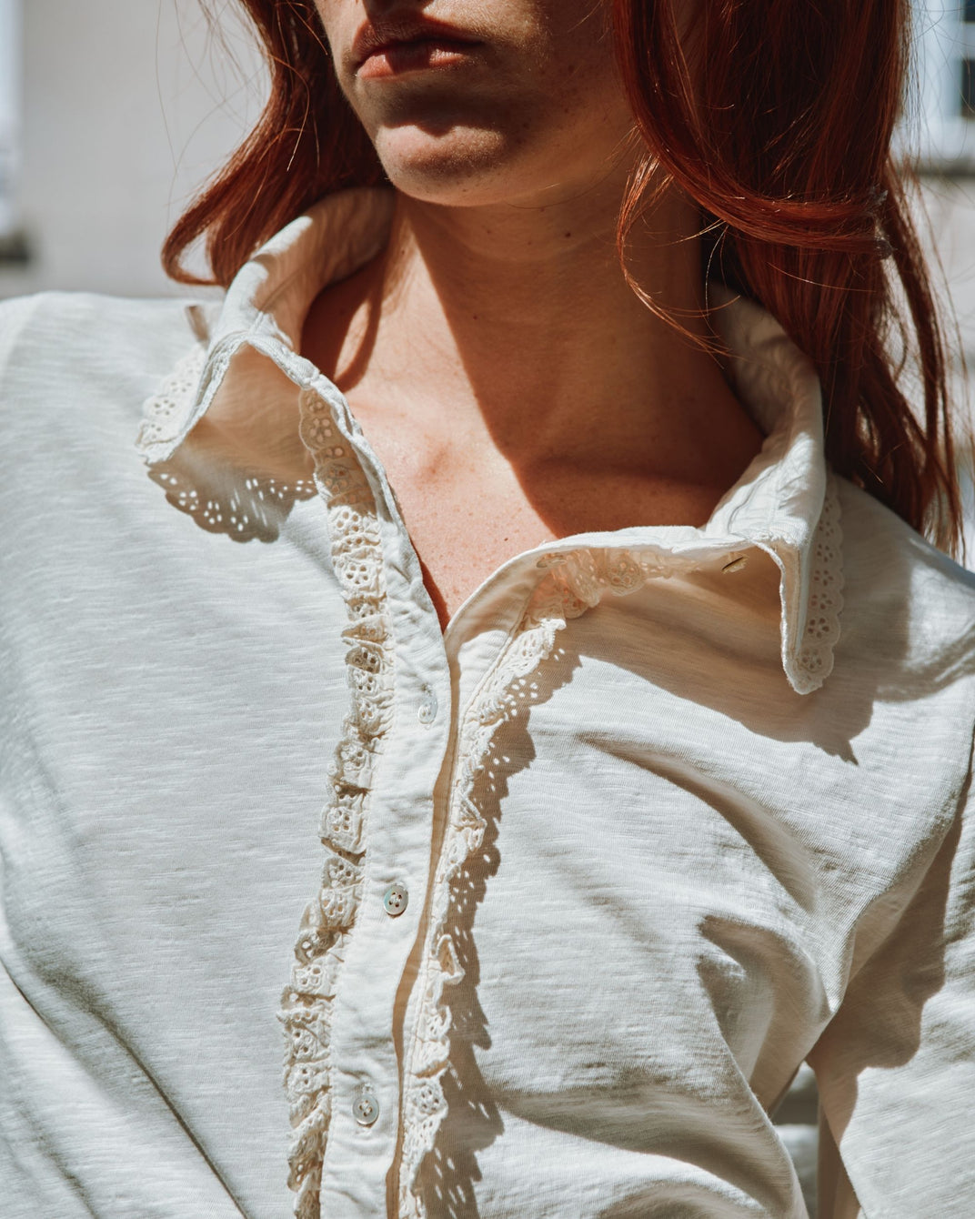 two-material polo shirt with cream jabot collar