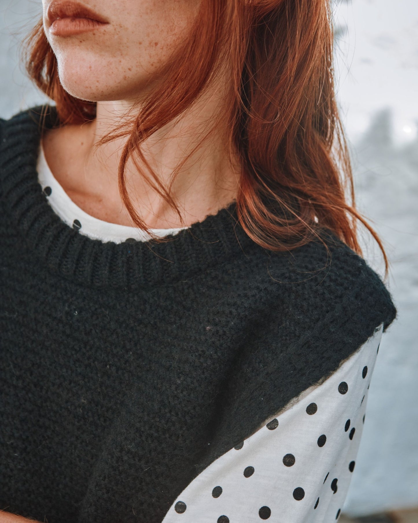 black sleeveless tie-up sweater