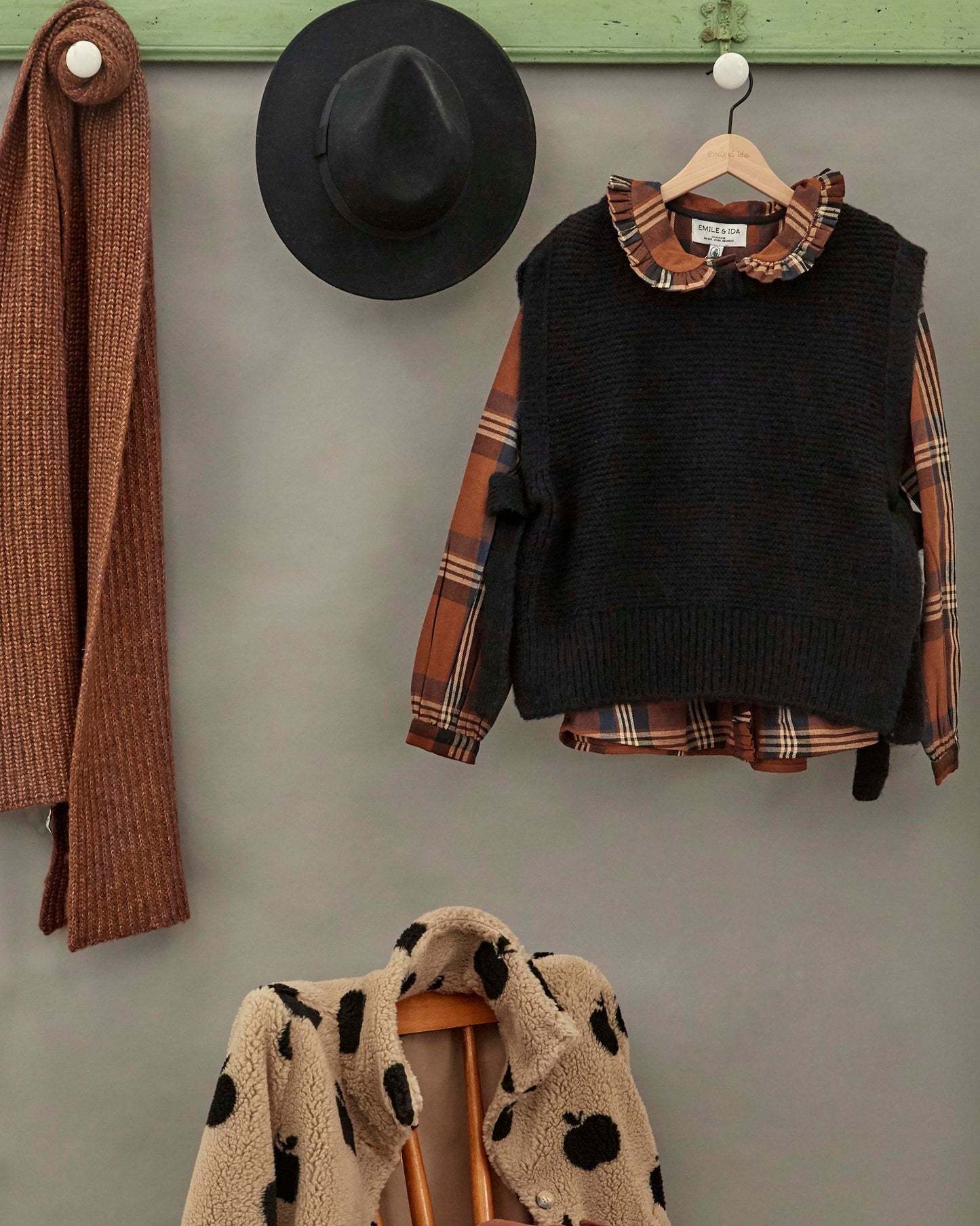 black sleeveless tie-up sweater