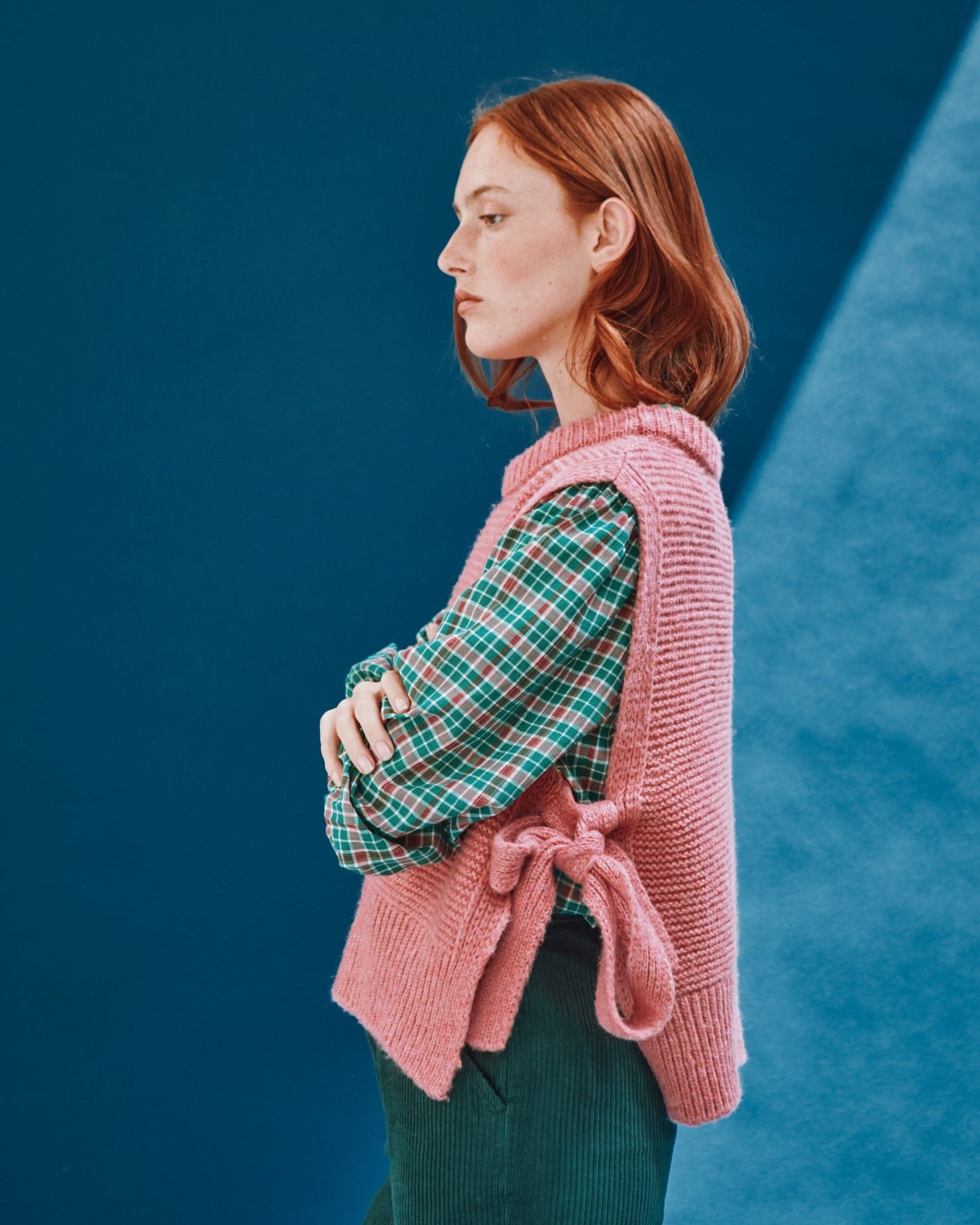 pink sleeveless tie-up sweater