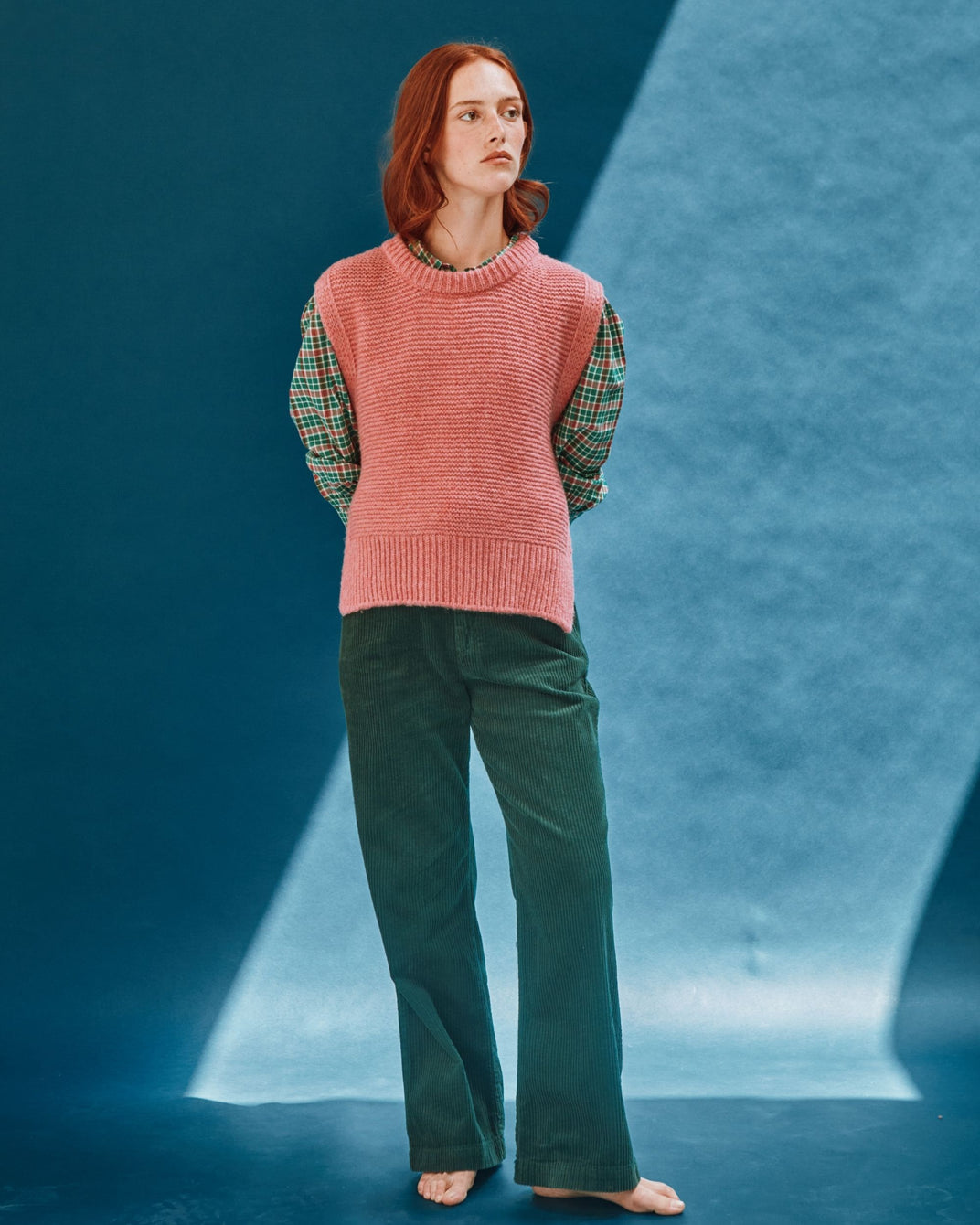 pink sleeveless tie-up sweater