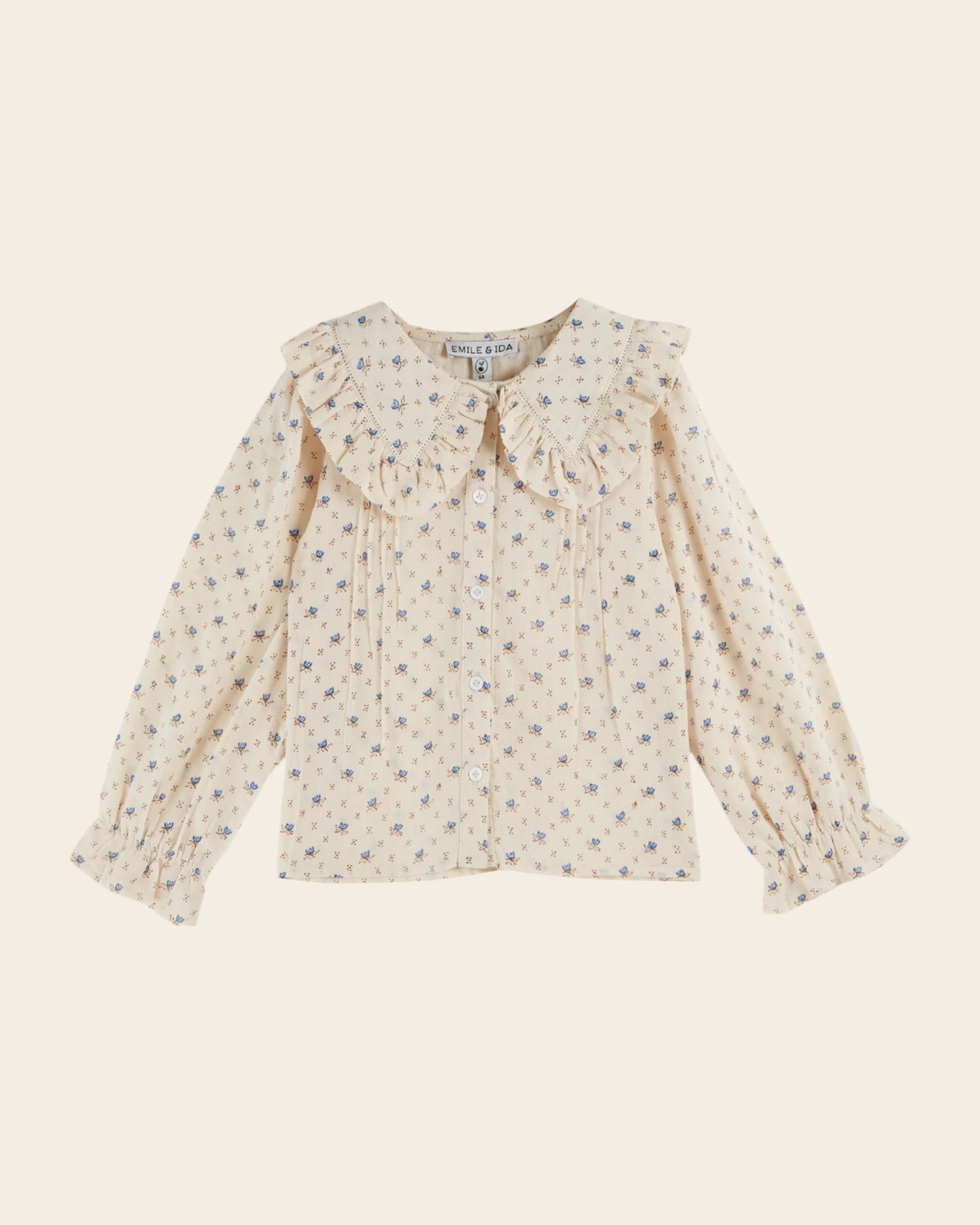 Blouse écrue à fleurs bleues