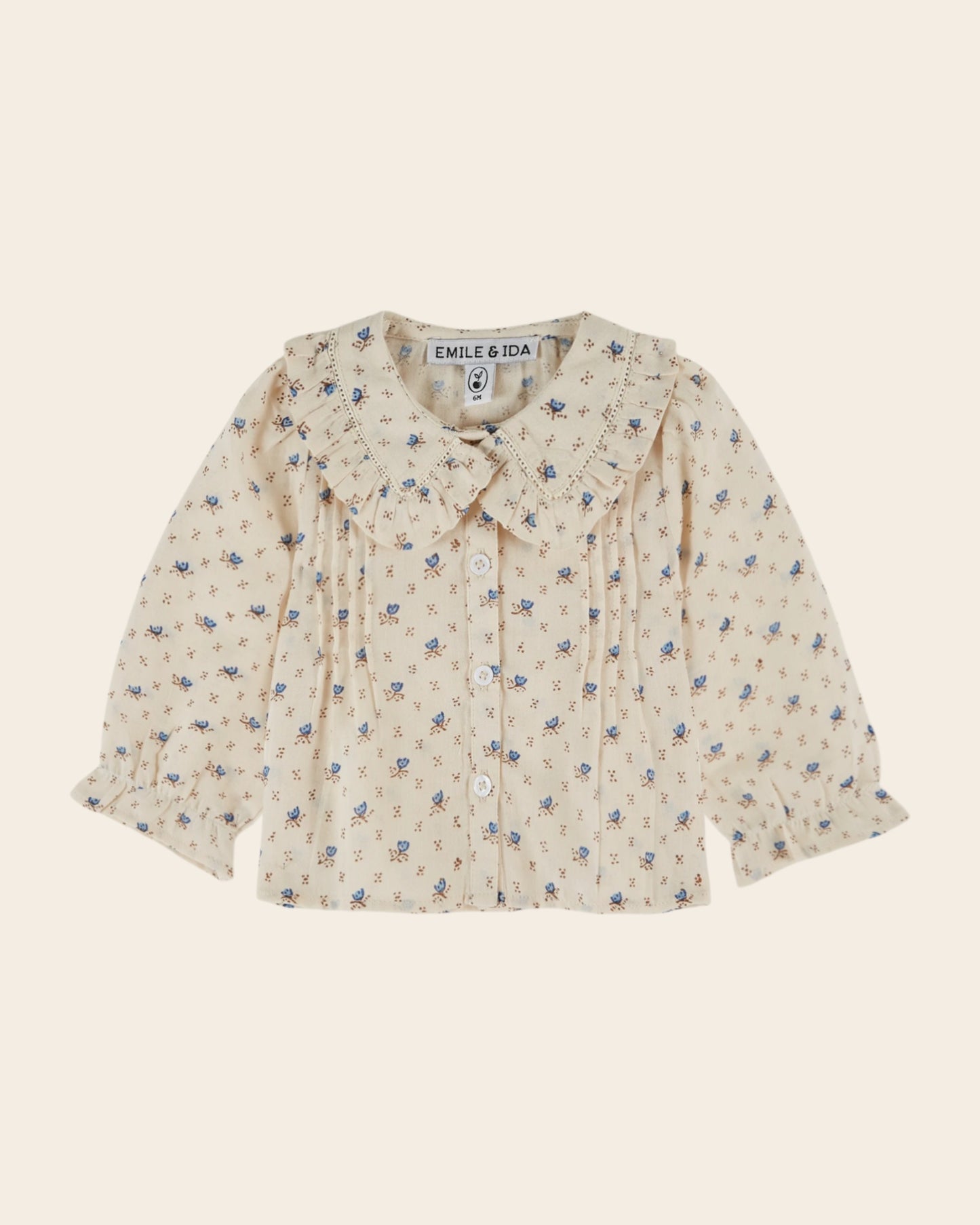 Blouse écrue à fleurs bleues