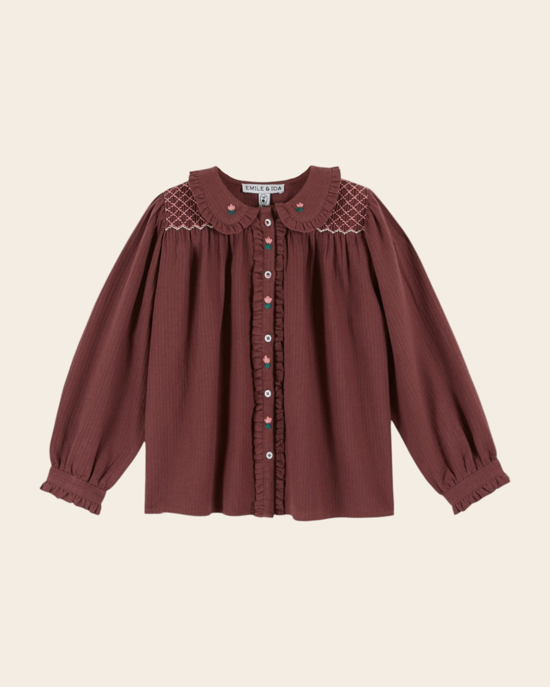 purple smocked blouse