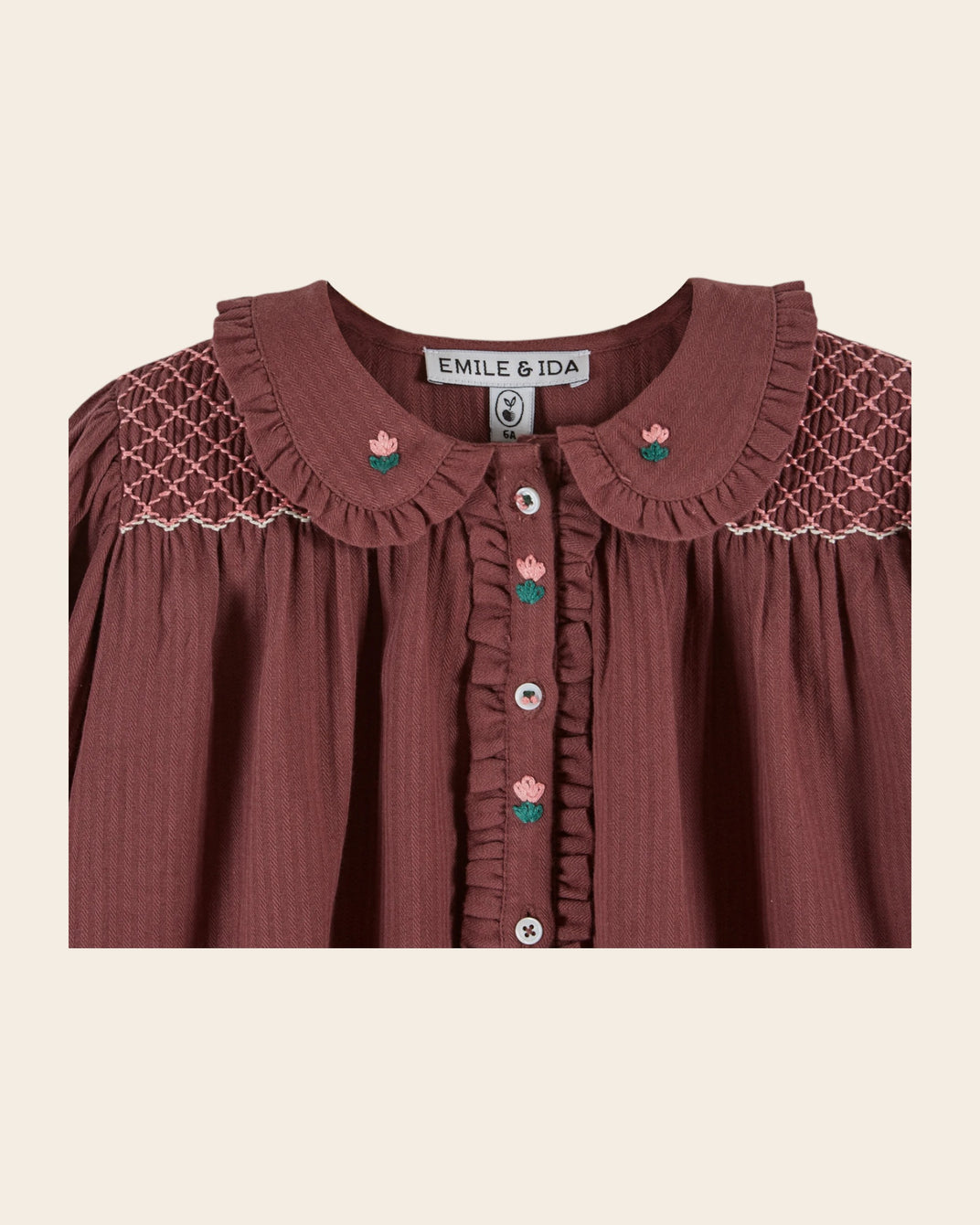 purple smocked blouse
