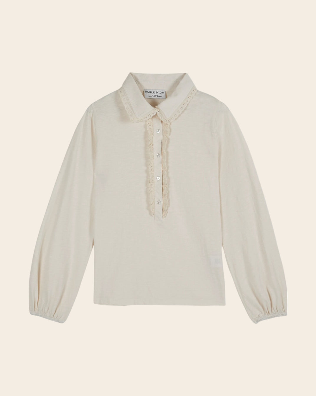 two-material polo shirt with cream jabot collar